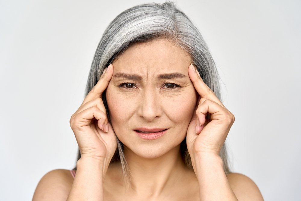 Woman experiencing signs of aging and its impact on metabolism