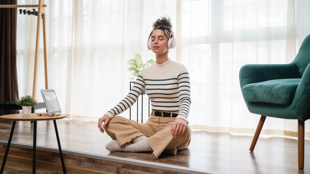 A woman practising self-care at home